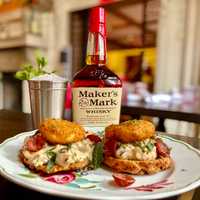 <p>Food and drink specials include a Mint Julep (back) and sausage biscuits (front)</p>