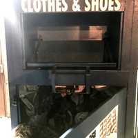 <p>The clothing bin behind the Broadway apartment building in Paterson where the woman was trapped.</p>