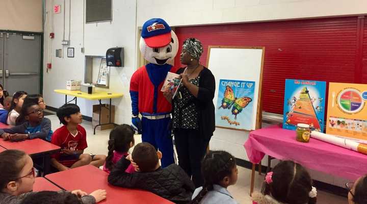 Kemi Pogue, program director of Home Run Against Drugs, and Homer, the program&#x27;s mascot.