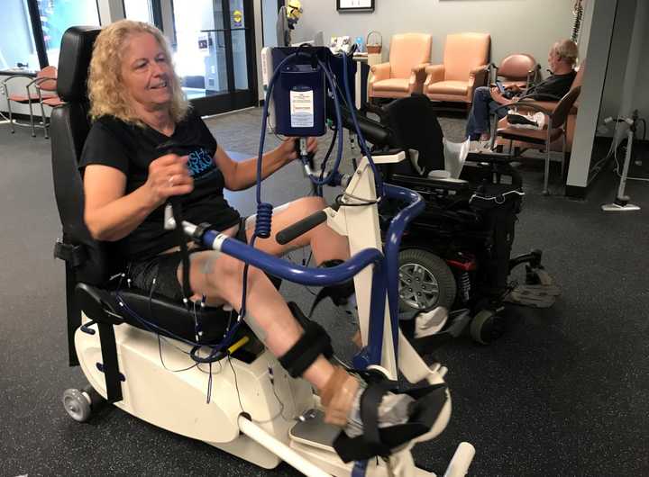 Lois Hamilton cools down from her workout on a specialized bike at Push to Walk in Oakland.