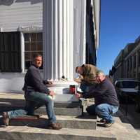 <p>Putnam Highway Department workers repair a pillar that is part of the historic Putnam County courthouse, which is more than 200 years old.</p>
