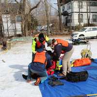 <p>The next diver is prepared for their turn in the water by MFVFD Dive Tenders</p>