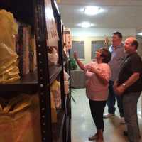 <p>Volunteers Jackie Catti, Tom Mulcahy and Al Catti at the Our Lady of Perpetual Help Church pantry.</p>