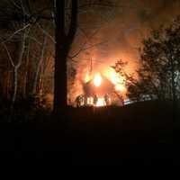 <p>A fire ripped through a two-story home on Shadow Lane in Wilton Thursday night.</p>