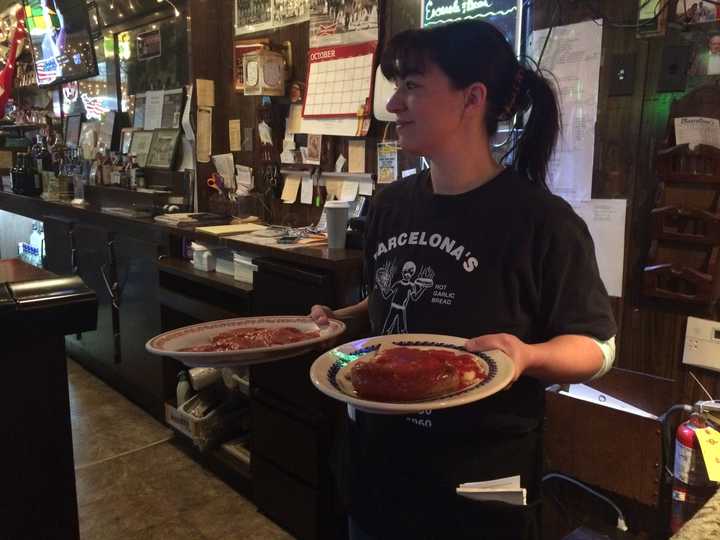 Server Stephanie Corona at Barcelona&#x27;s Restaurant in Garfield. The restaurant serves a host of Italian fare, along with pizza.