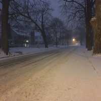 <p>The plows have already been out, but Deer Hill Avenue in Danbury is snow-covered at about dawn on Thursday. A couple of inches of snow are already on the ground, with up to 14 inches possible.</p>