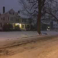 <p>The plows have already been out, but Deer Hill Avenue in Danbury is snow-covered at about dawn on Thursday. A couple of inches of snow are already on the ground, with up to 14 inches possible.</p>