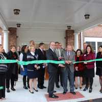 <p>George Ciaccio cuts the ribbon to officially open Wilton Commons Congregate. Nick Lundgren, deputy commissioner of the state&#x27;s Dept. of Housing, is left of Ciaccio, and Renee Dobos, CEO of MHA, is to the right.</p>