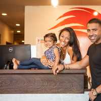 <p>Co-Owners Thara Prashad and Jay Sean with their daughter at their Tenafly studio.</p>