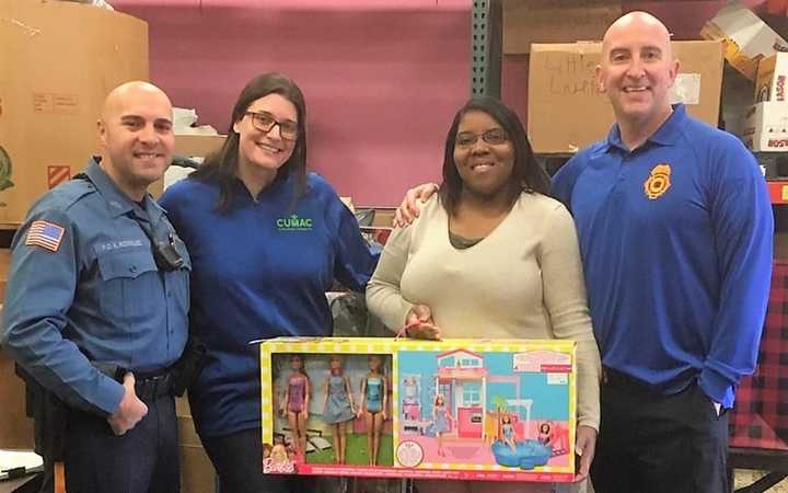 (left to right:) Upper Saddle River PBA Local #218  President Ken Rodriguez, CUMAC Director of Development Stephanie Ames, CUMAC Program Coordinator Akeera Weathers, Detective Lt. Edward Kane