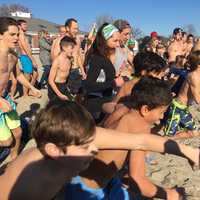 <p>Plungers head for Long Island Sound for the 10th annual Polar Plunge at Westport&#x27;s Compo Beach.</p>