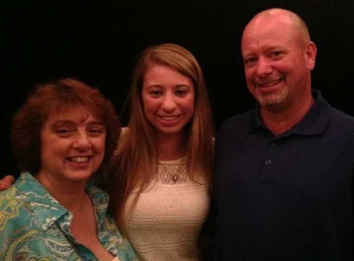 Lauren Rhein poses with her mother and father.