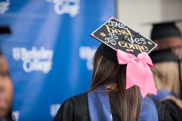 A graduate of Berkeley College in Paramus shows off her mortar board.