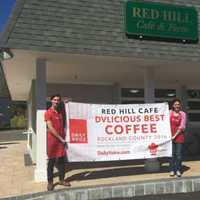 <p>Josh Hansen, left, and Elena Hansen, right, of Red Hill Cafe in New City hold up their DVlicious sign for &quot;Best Coffee in Rockland County.&quot;</p>