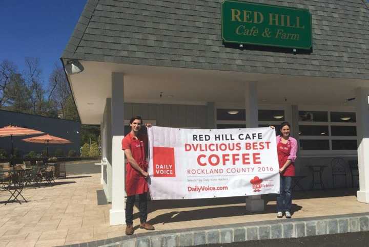 Josh Hansen, left, and Elena Hansen, right, of Red Hill Cafe in New City hold up their new DVlicious sign for &quot;Best Coffee in Rockland County.&quot;