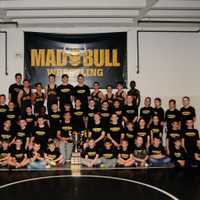 <p>The Norwalk Mad Bulls team shows their championship hardware.</p>