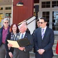 <p>Westport First Selectman James Marpe reads a proclamation designating Nov. 29, 2016 as Giving Tuesday in Westport. Standing on the steps of the Westport Country Playhouse, he is surrounded by representatives of local nonprofits.</p>