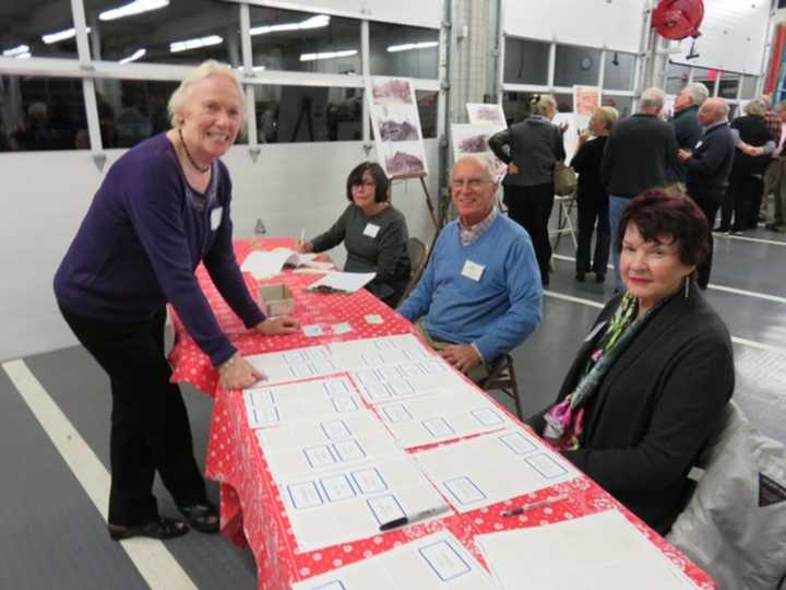 Regina Vassak, Susie Thompson, John Vassak and Jane Knox at the reception desk at the North Salem Historical Society&#x27;s annual meeting at the new Croton Falls Firehouse.