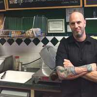 <p>Eddie Tisi keeps food fresh at his old-school Fair Lawn deli.</p>