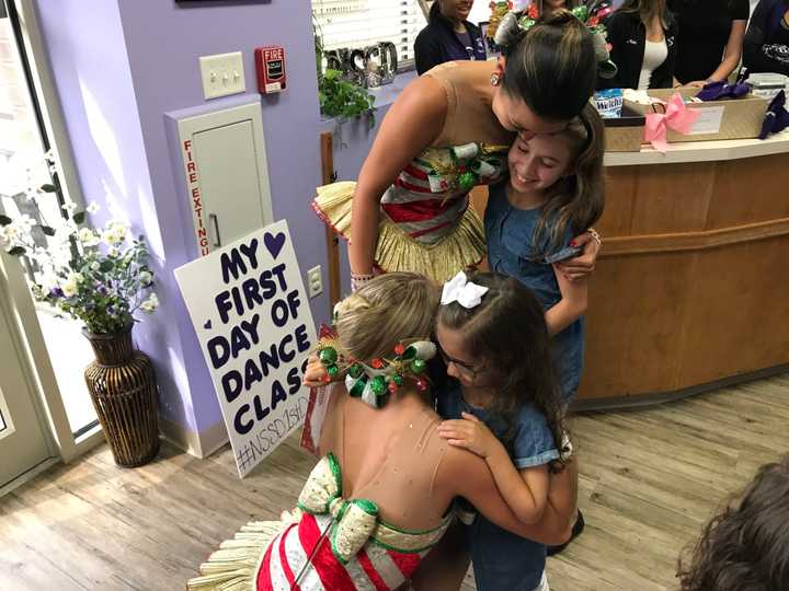 Sisters Breanna and Crystal Pereira were surprised when two Radio City Rockettes showed up to their dance studio Thursday.