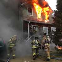 <p>The second floor at 47 Pickens Street was fully engulfed as emergency workers arrived for the 8 a.m. call.</p>