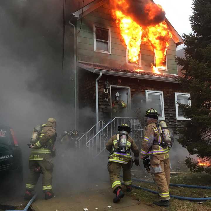 The second floor at 47 Pickens Street was fully engulfed as emergency workers arrived for the 8 a.m. call.