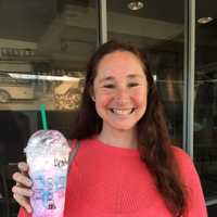 <p>Heatherly Law shows off her Unicorn Frappuccino at the Starbucks in Trumbull.</p>