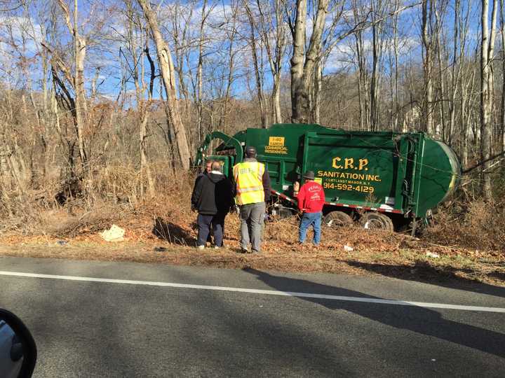 A sanitation truck drove off the road in Briarcliff. 