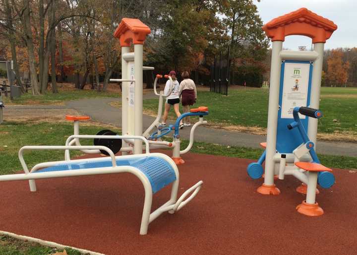 People walk through Municipal Field in Franklin Lakes, now including fitness equipment. 
