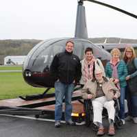 <p>(Front Row) Paul Hurd (Back Row L to R) Nick, Pilot at Centennial Helicopters, Kelly Coppola, Activities Director at Crosby Commons, Cristina Sinanian, daughter of Paul, and Lori Pisani, Executive Director of Crosby Commons.</p>