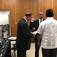 <p>Edgar Olave being sworn in.</p>