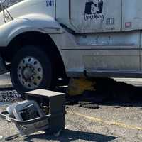 <p>The tractor got lodged on the concrete stanchion at the Super Fresh in Glen Rock.</p>