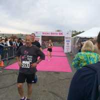 <p>Zofia Wieciorkowska crosses the finish line at the Vicki Soto 5K.</p>