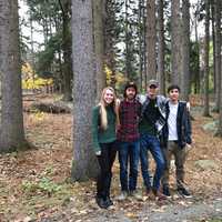 <p>Intern Kristen Jajko, former intern John Curnyn, and interns Liam Hickey and Kyle Fedele stand together on the Weis property in Ringwood.</p>