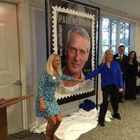 <p>Clea and Nell Newman, daughters of actor Paul Newman, show off the stamp of their father. </p>