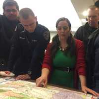 <p>HR Coordinator Liz Twiggs maps out a course of action for Operation Santa Boone.</p>