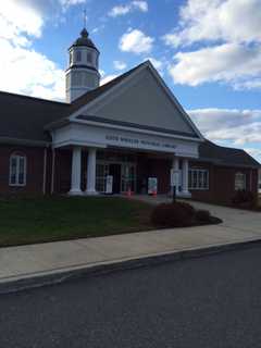 Monroe Library Holding Jigsaw Puzzle Contest