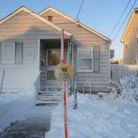 <p>This Hawthorne lawn on 7th Avenue is piled with homemade snow as a send-off to winter.</p>