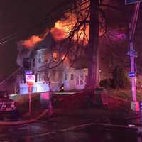 <p>Firefighters were ordered out of the house when smoke and fire began engulfing the house, bringing the blaze to a third alarm.</p>