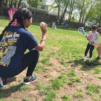 <p>Saddle Brook High School varsity lacrosse players Kayla Chowdhury and Karissa Quimby help a young &quot;Angel&quot; get a feel for the stick Saturday at Avon Field.</p>