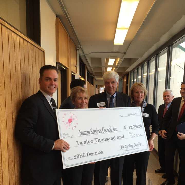 The Appleby Family presents the Human Services Council with a check Friday.