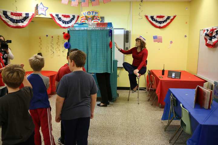 Students at Benjamin Franklin Elementary School wait in line to vote for president.