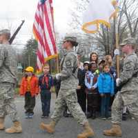 <p>Members of a Marist College Army R.O.T.C. Color Guard unit marched past young scouts in Wappingers Falls on Wednesday during a Veterans Day ceremony.</p>