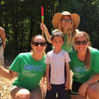 <p>Kai Miles, 5, surrounded by MEVO summer interns Aprelle O&#x27;Harra, Marisa Dickman, and Ursula Svoboda.</p>