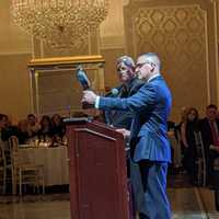 <p>Russo presents a statue to Old Tappan Police Chief Thomas Shine, the BCPCA&#x27;s immediate past president.</p>