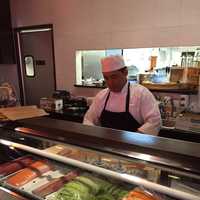 <p>A chef prepares sushi at Soosh in Stamford.</p>