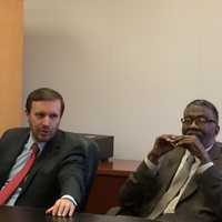 <p>U.S. Sen. Christopher Murphy, left, listens to residents at a Bridgeport roundtable on energy assistance, as Charles Tisdale, executive director of Action for Bridgeport Community Development, looks on.</p>