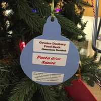 <p>The Christmas tree in the Western Connecticut State University midtown campus student center is decorated with ornaments that list items needed by the Greater Danbury Food Bank.</p>