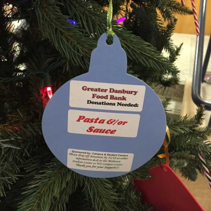 The Christmas tree in the Western Connecticut State University midtown campus student center is decorated with ornaments that list items needed by the Greater Danbury Food Bank.