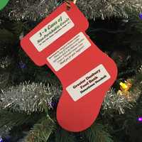 <p>The Christmas tree in the Western Connecticut State University midtown campus student center is decorated with ornaments that list items needed by the Greater Danbury Food Bank.</p>